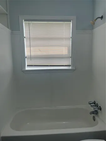 a close up of a bathtub in a bathroom