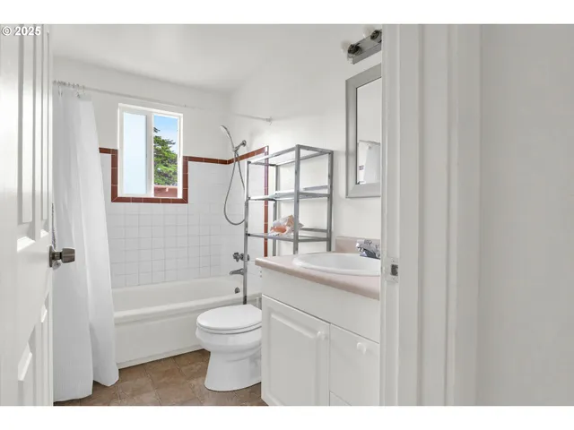 a bathroom with a toilet a sink and a bathtub