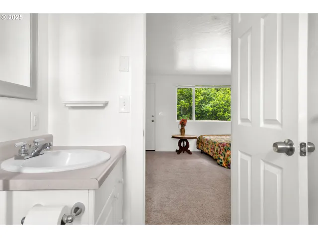 a bathroom with a sink and a window