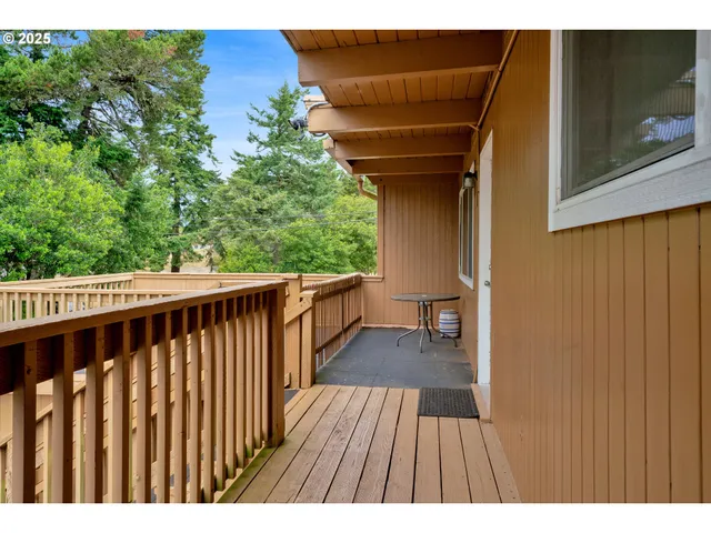 a balcony with wooden floor