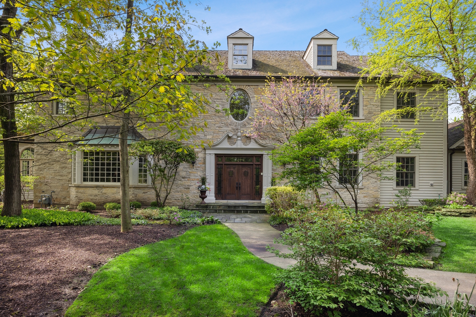905 Voltz Road Northbrook, IL 60062 - Photo 1 of 58 a front view of a house with garden