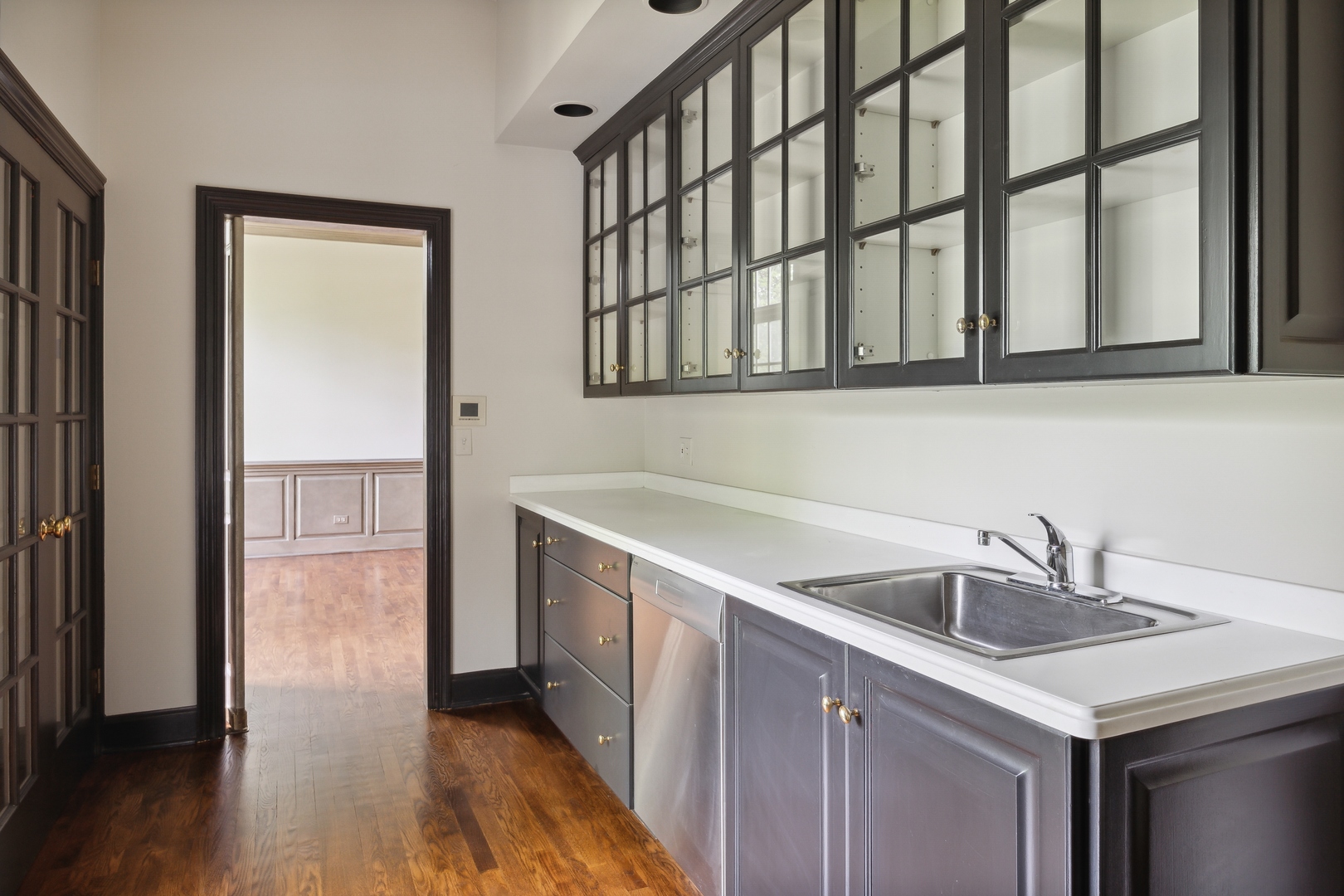 905 Voltz Road Northbrook, IL 60062 - Photo 24 of 58 a kitchen with a sink and a refrigerator