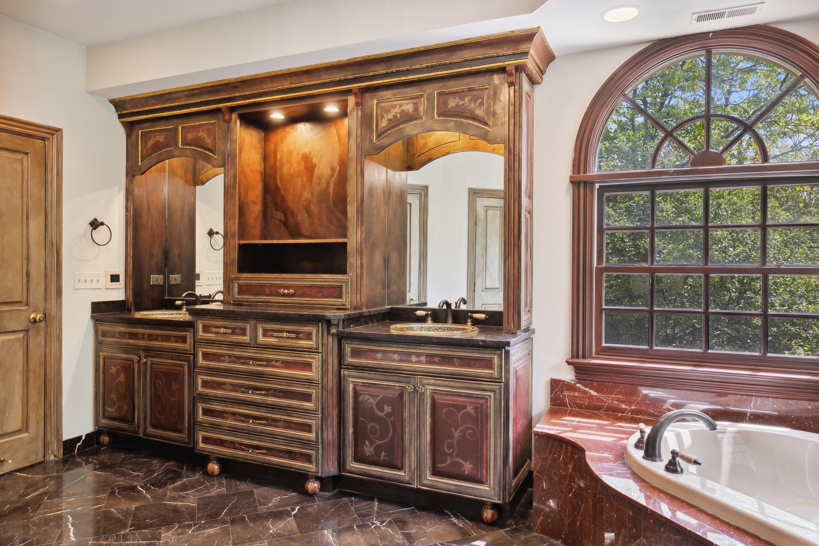905 Voltz Road Northbrook, IL 60062 - Photo 31 of 58 a bathroom with a sink a vanity and a mirror