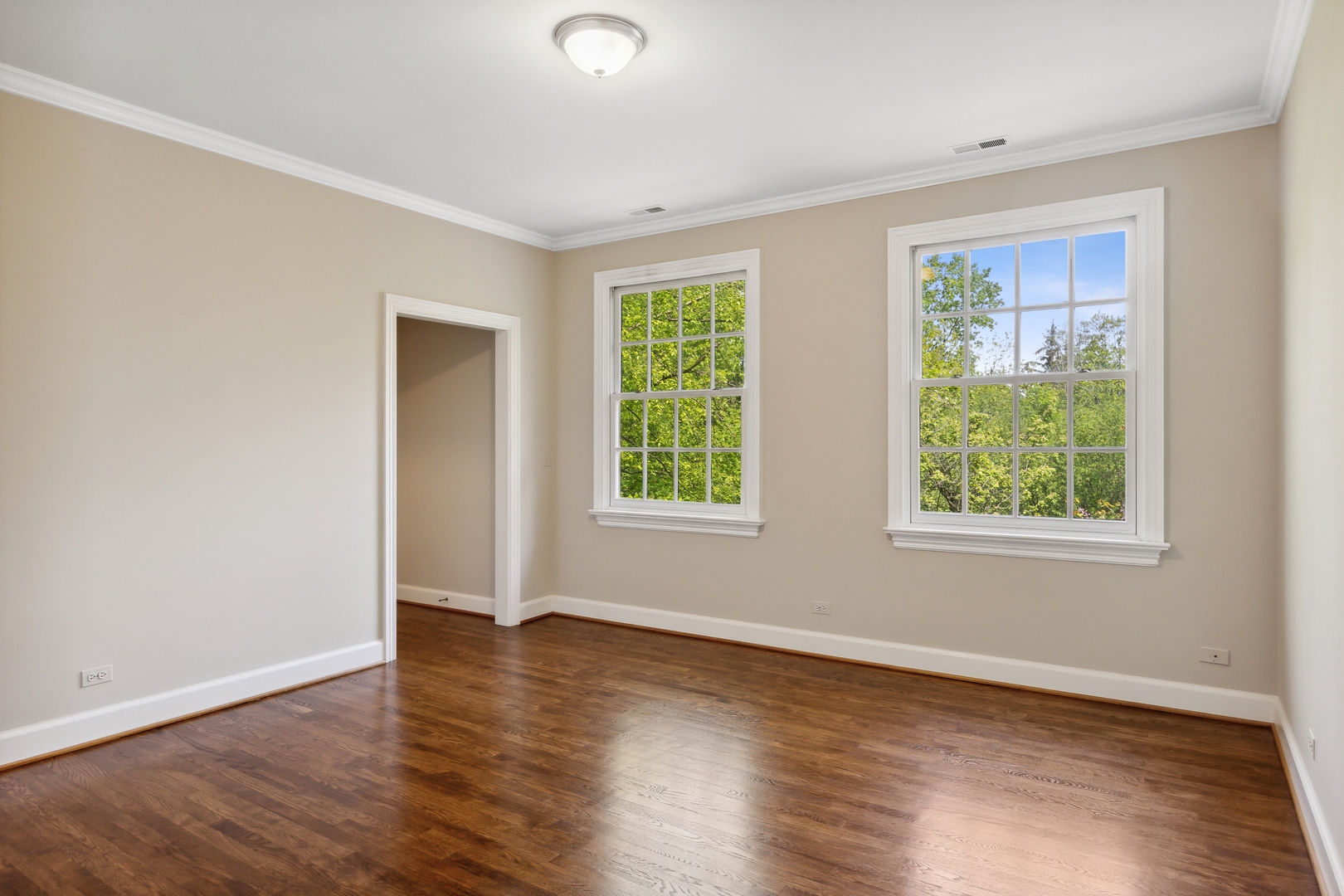 905 Voltz Road Northbrook, IL 60062 - Photo 33 of 58 a view of an empty room with wooden floor and a window
