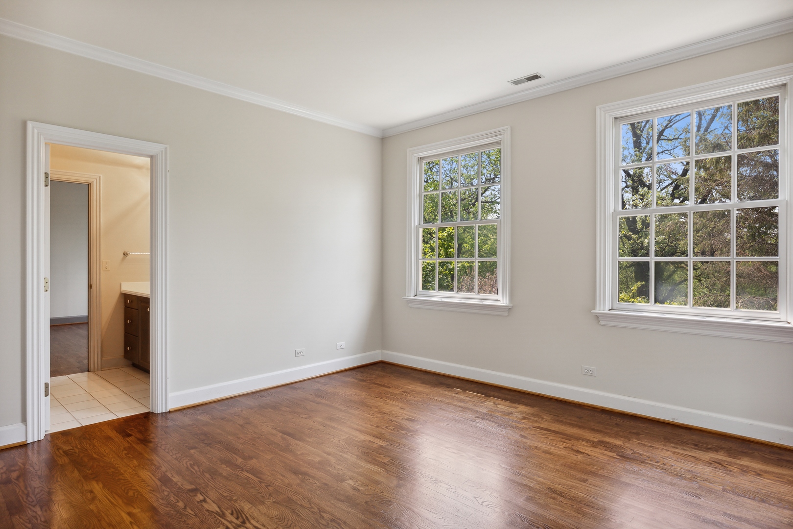 905 Voltz Road Northbrook, IL 60062 - Photo 35 of 58 an empty room with wooden floor and windows
