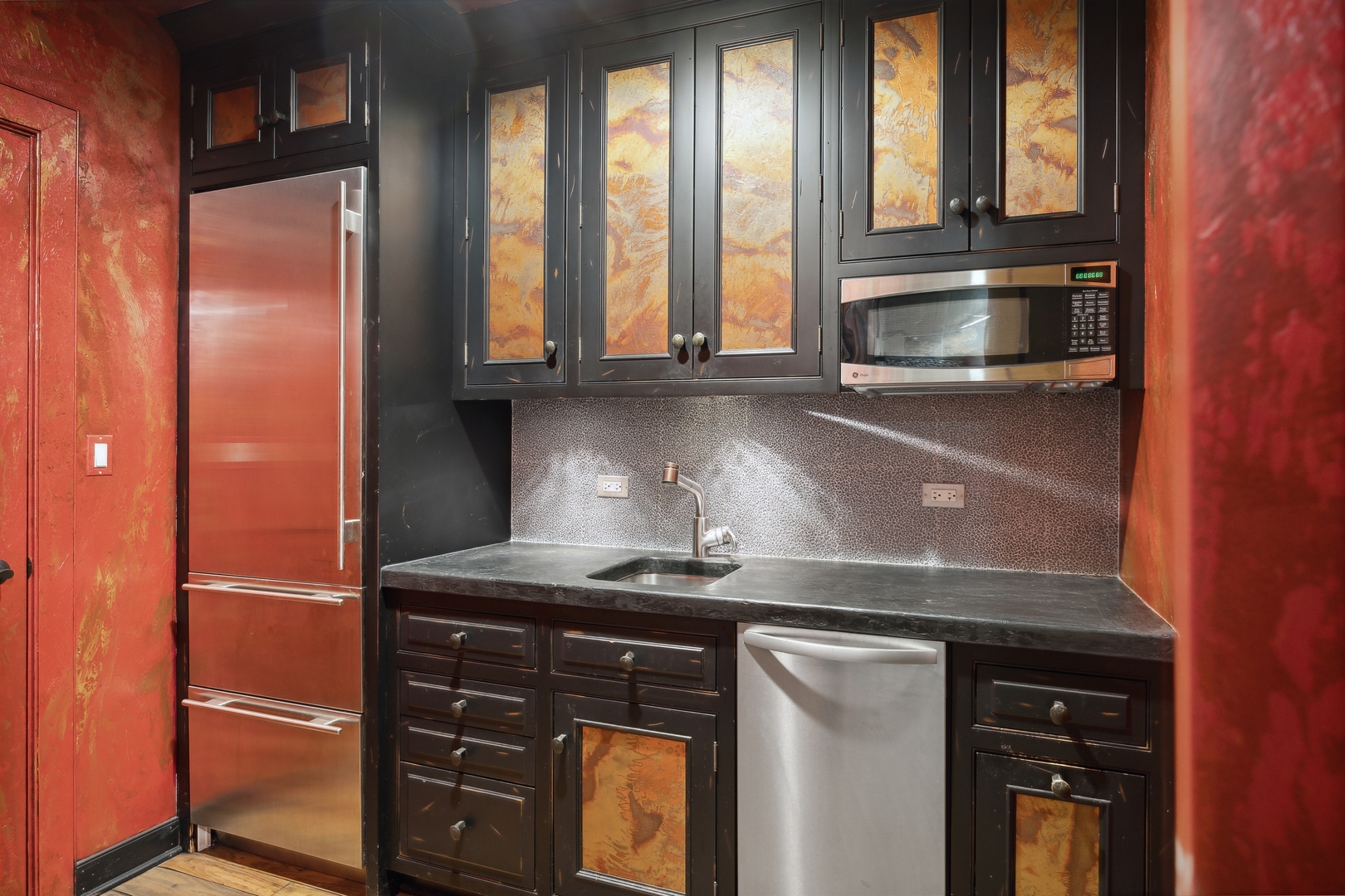 905 Voltz Road Northbrook, IL 60062 - Photo 44 of 58 a kitchen with granite countertop a refrigerator and wooden cabinets