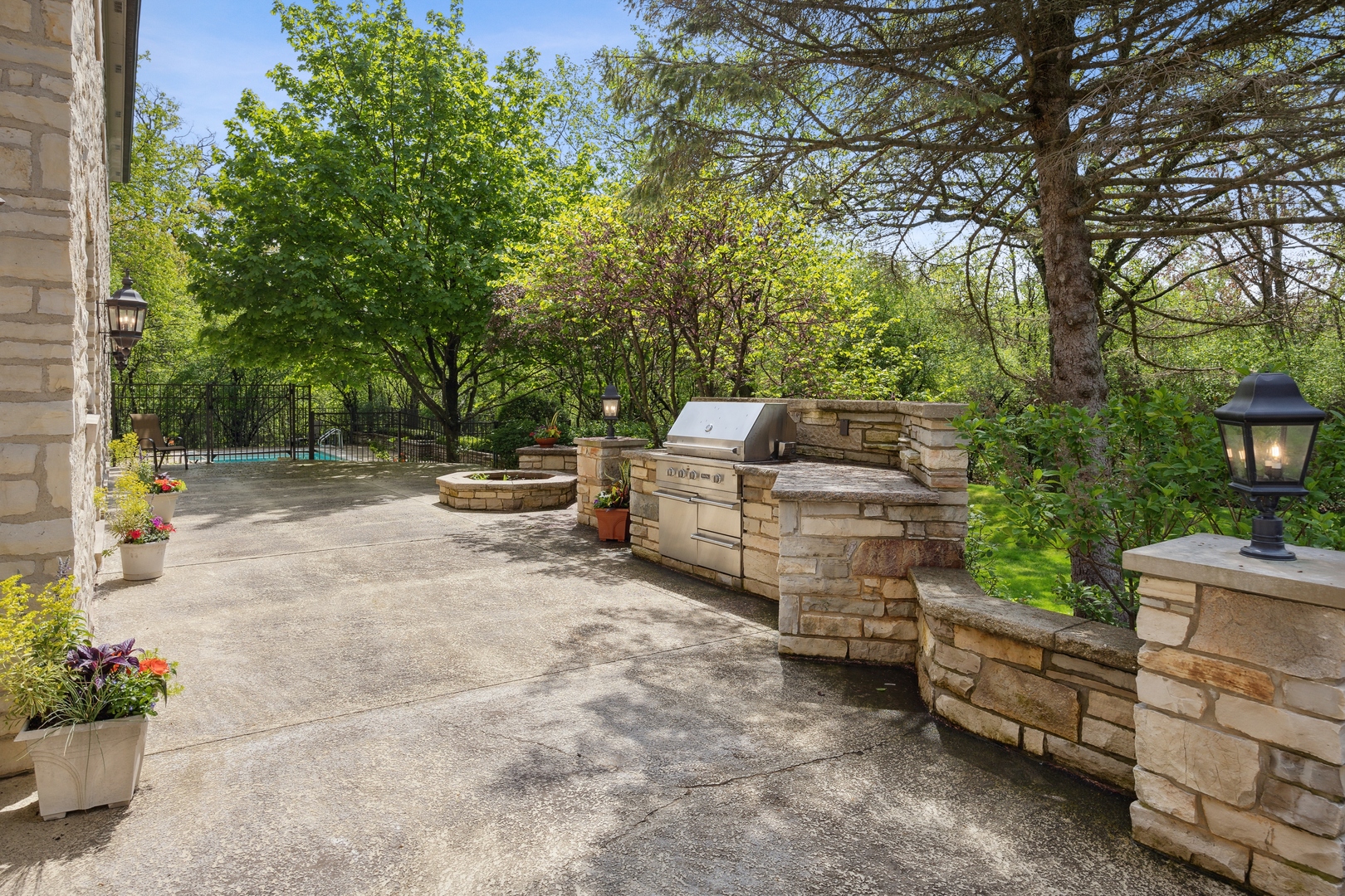 905 Voltz Road Northbrook, IL 60062 - Photo 50 of 58 a backyard of a house with barbeque oven and outdoor seating