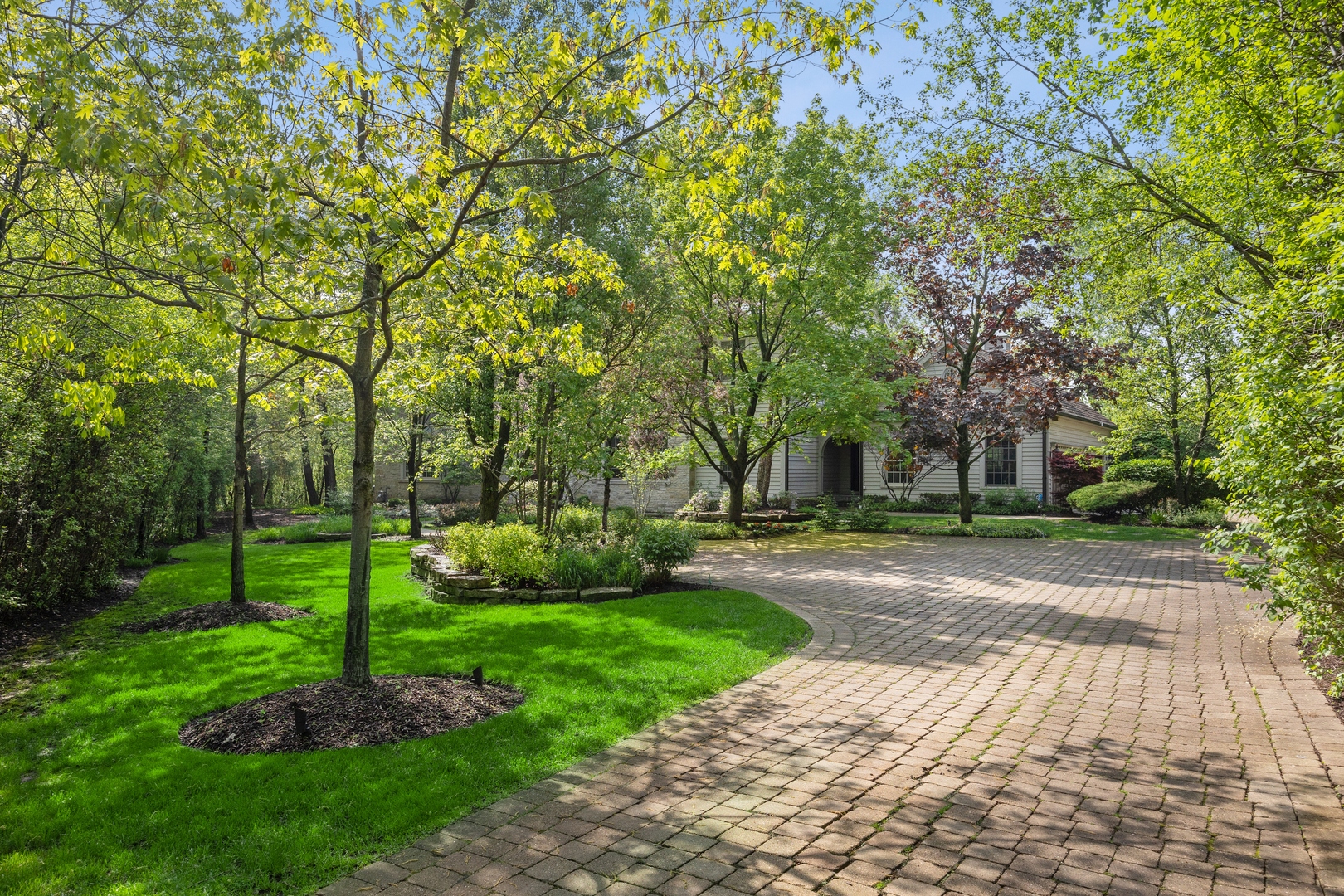 905 Voltz Road Northbrook, IL 60062 - Photo 5 of 58 a green field with trees in the background