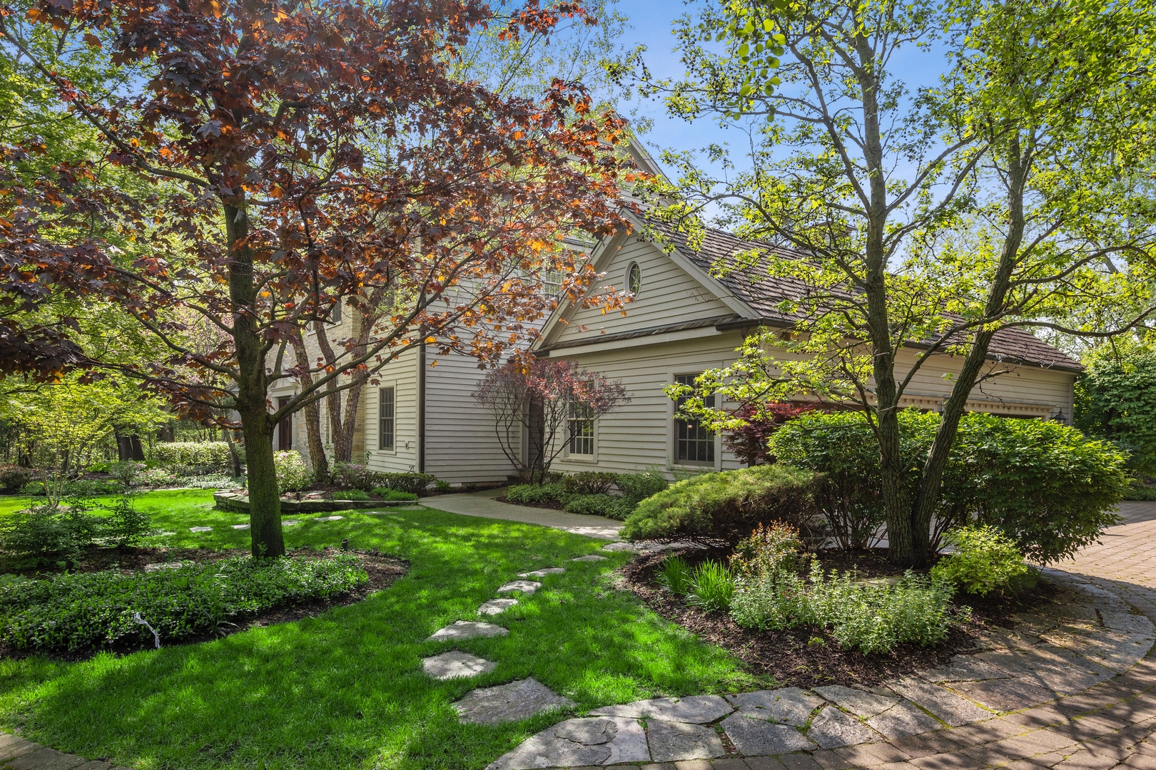 905 Voltz Road Northbrook, IL 60062 - Photo 6 of 58 a front view of a house with garden