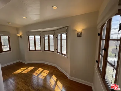 a bathroom with a bathtub and a table
