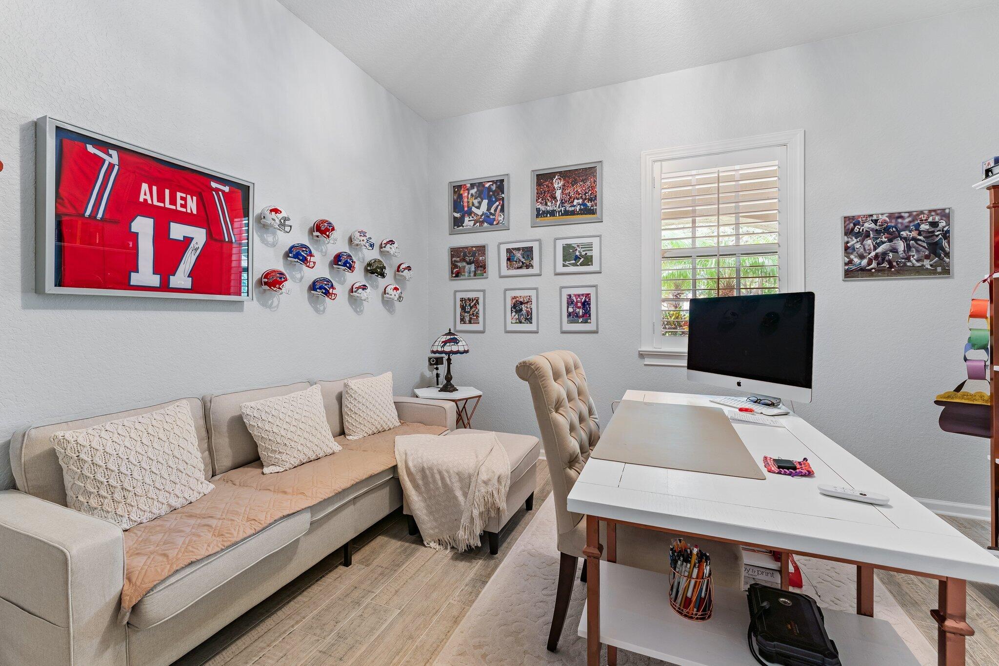 108 Via Azurra Jupiter, FL 33458 - Photo 14 of 78 a living room with furniture and a flat screen tv