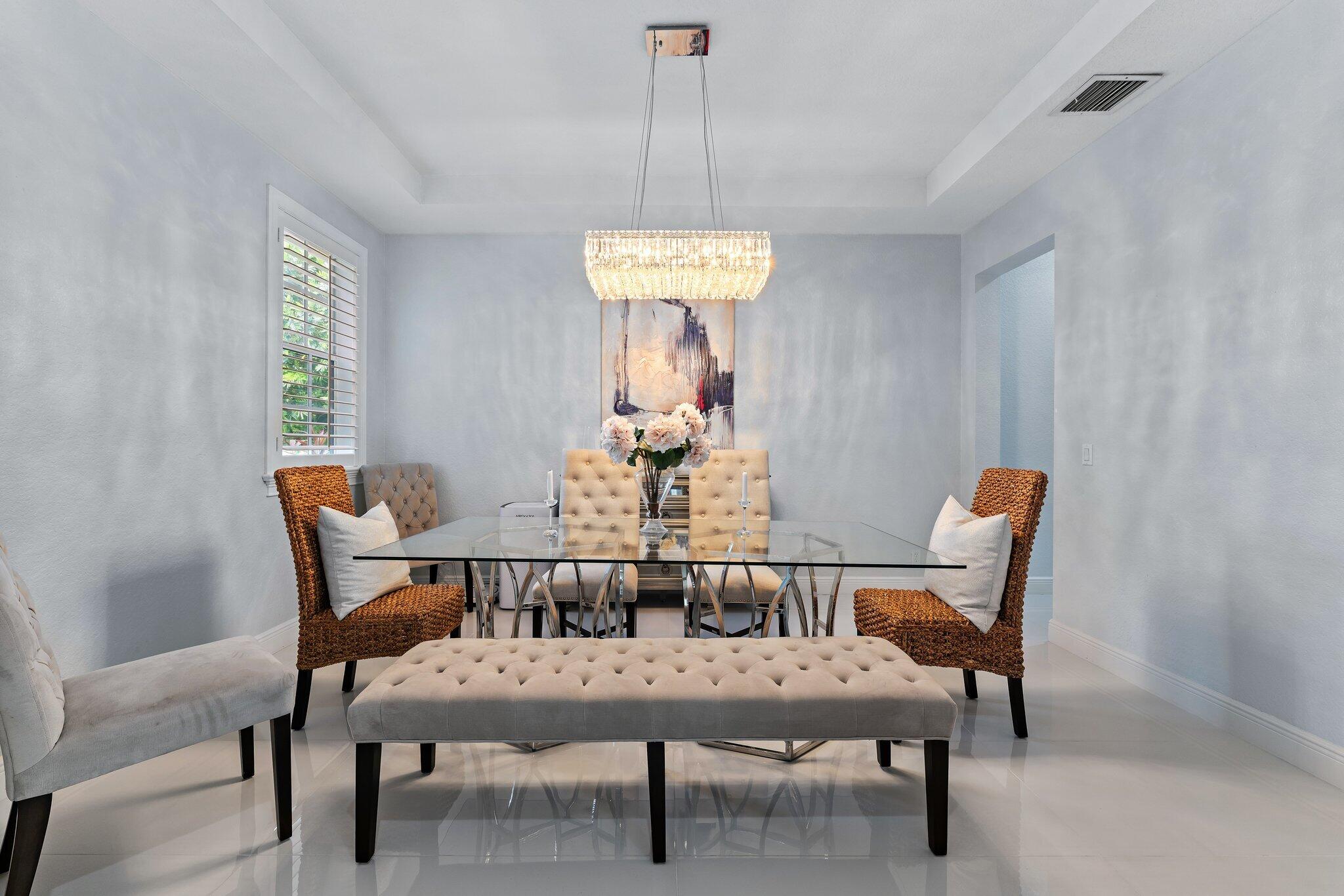 108 Via Azurra Jupiter, FL 33458 - Photo 16 of 78 a dining room with furniture and window