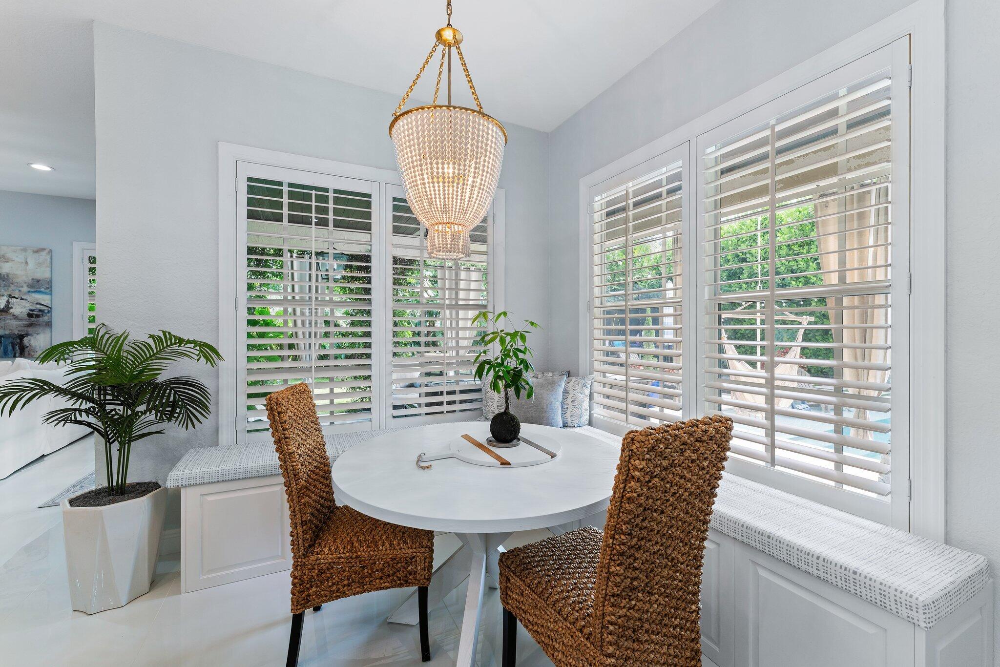 108 Via Azurra Jupiter, FL 33458 - Photo 26 of 78 a view of a dining room with furniture window and wooden floor