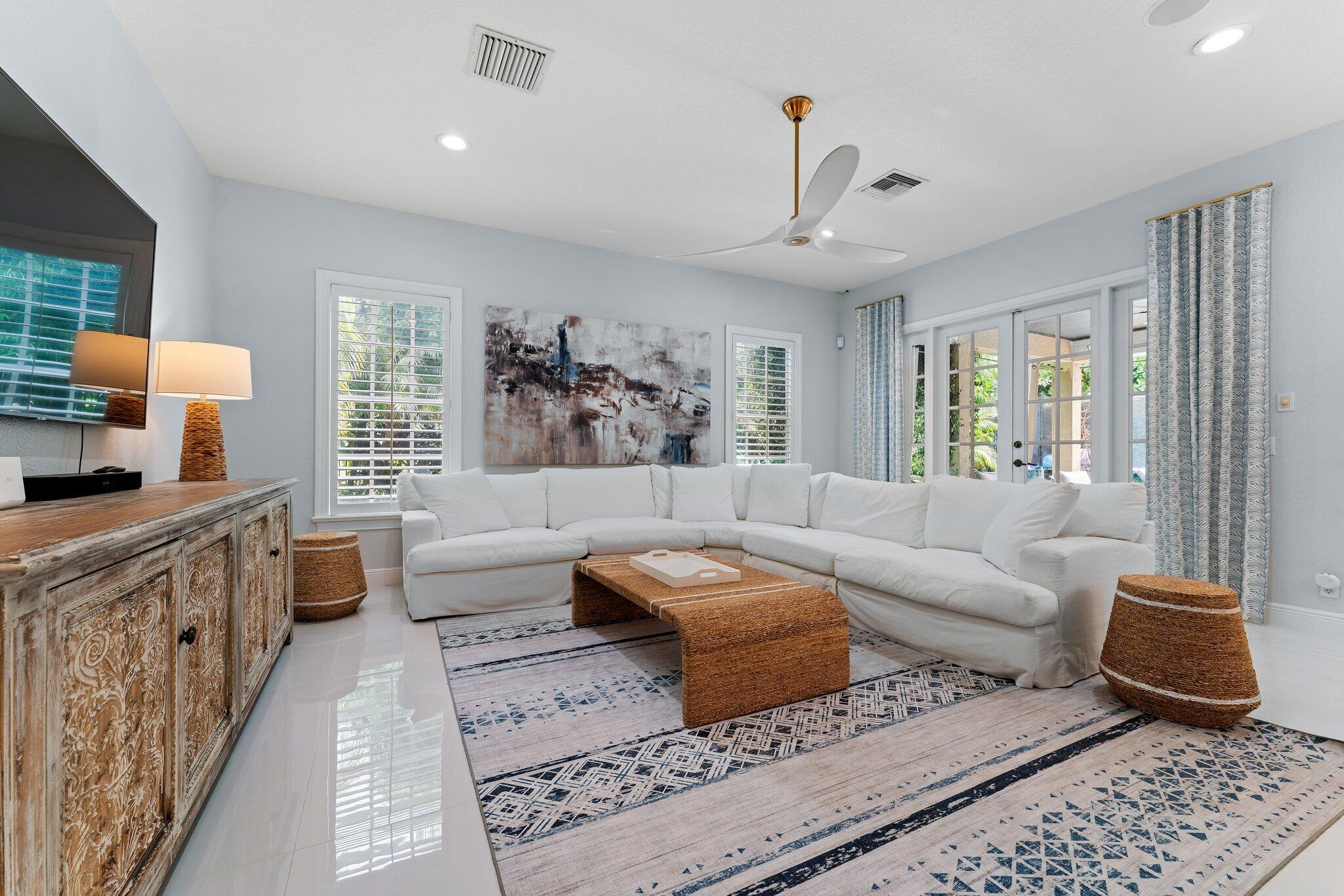 108 Via Azurra Jupiter, FL 33458 - Photo 30 of 78 a living room with furniture and a large window