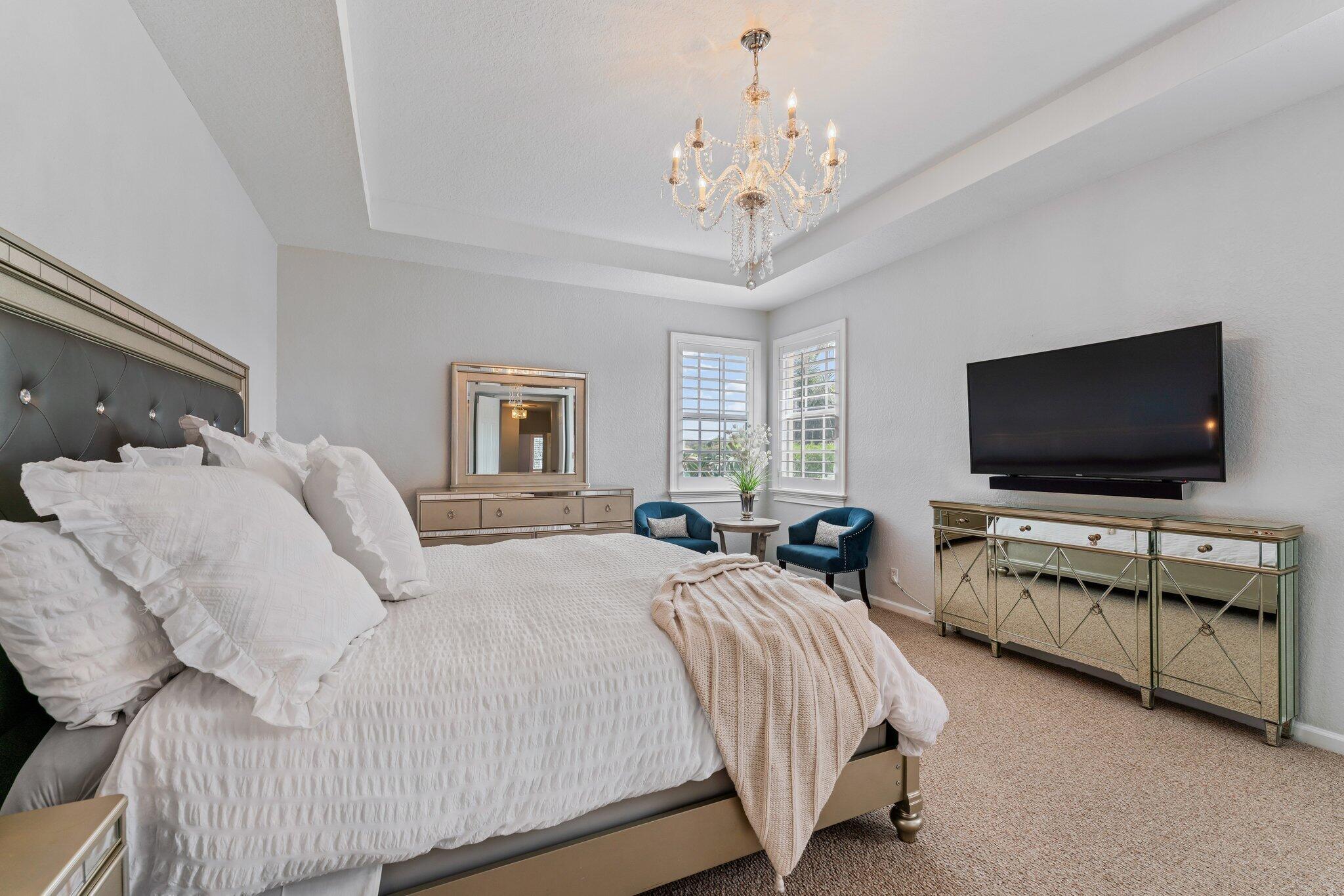 108 Via Azurra Jupiter, FL 33458 - Photo 45 of 78 a bedroom with bed tv and flat screen tv