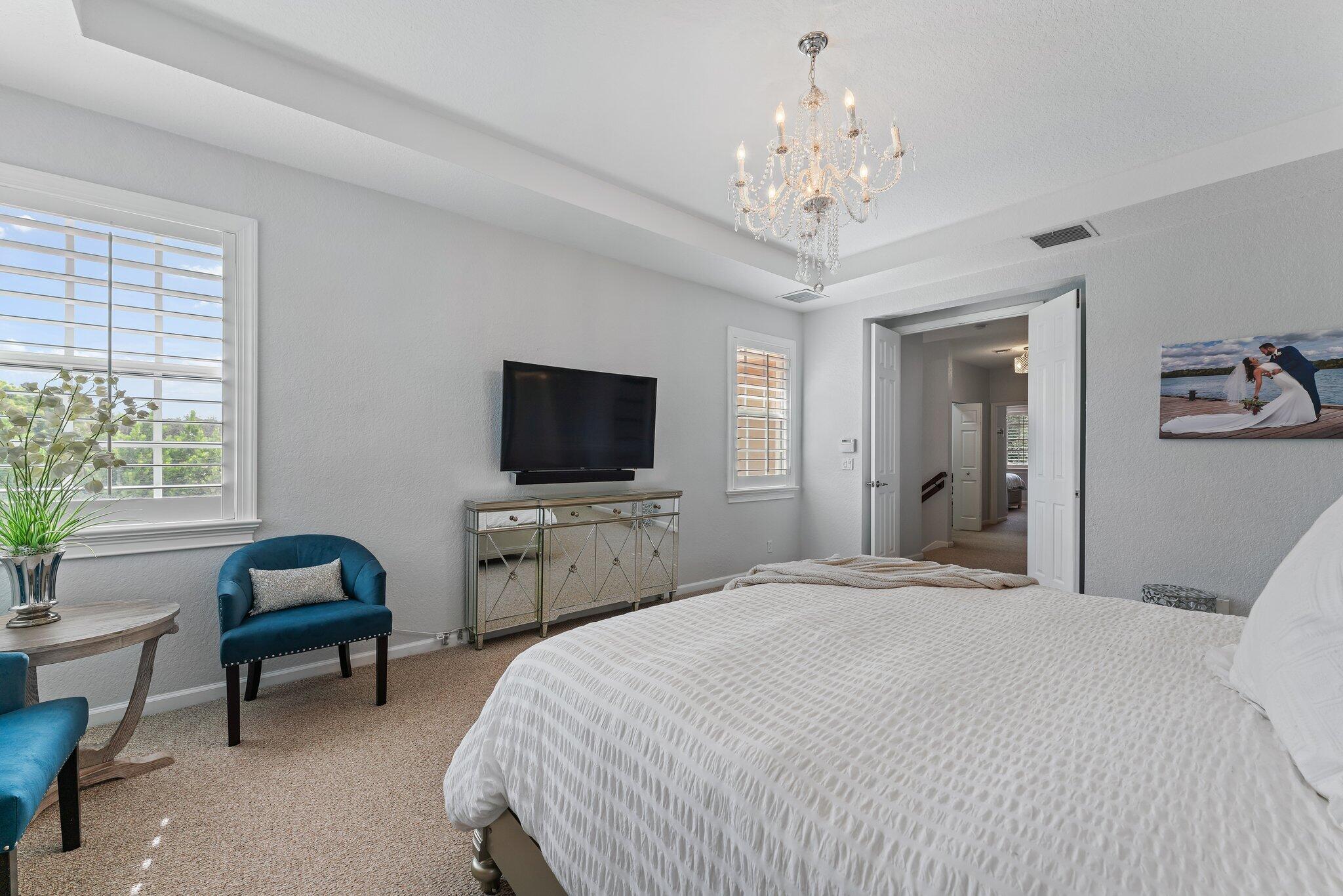 108 Via Azurra Jupiter, FL 33458 - Photo 46 of 78 a bedroom with bed tv and window