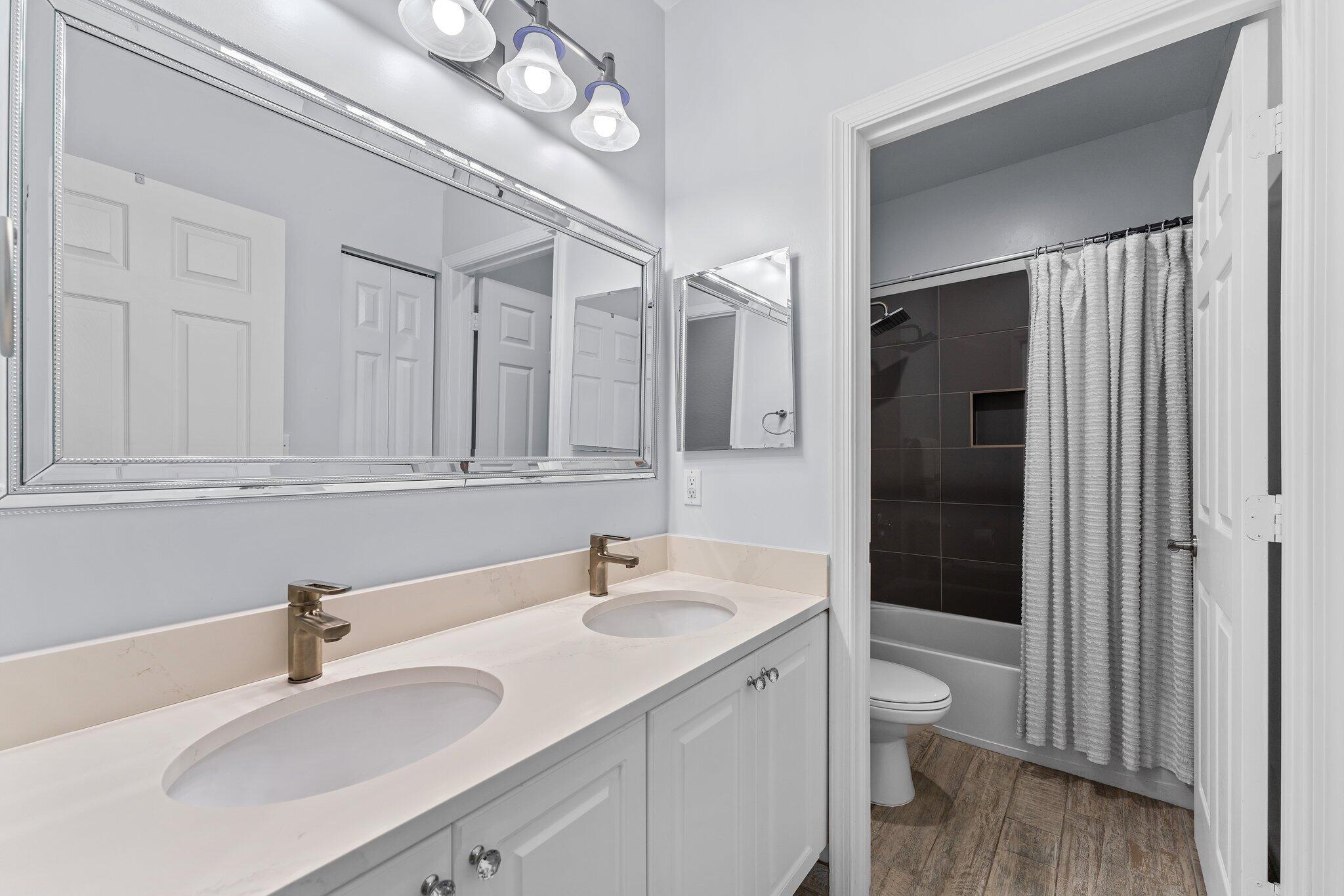 108 Via Azurra Jupiter, FL 33458 - Photo 54 of 78 a bathroom with a sink and a mirror