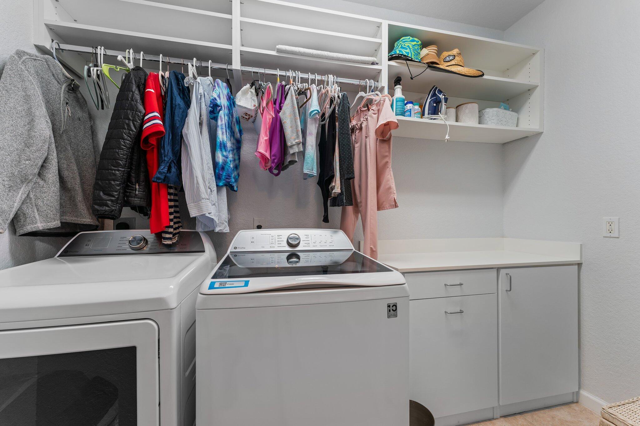 108 Via Azurra Jupiter, FL 33458 - Photo 60 of 78 a view of walk in closet with clothes
