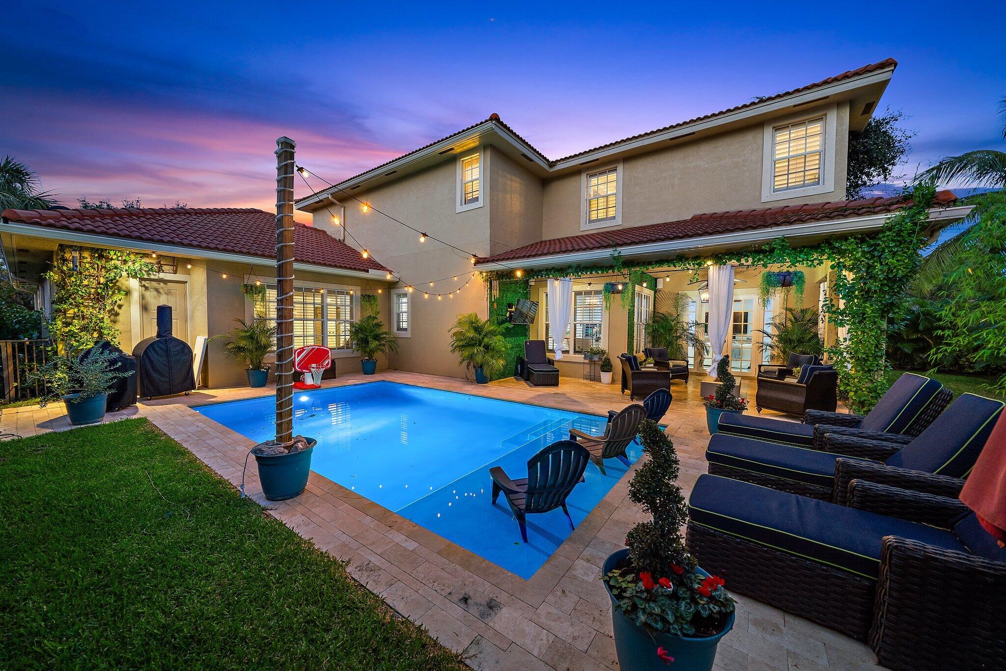 108 Via Azurra Jupiter, FL 33458 - Photo 68 of 78 a view of an chairs and tables in the patio
