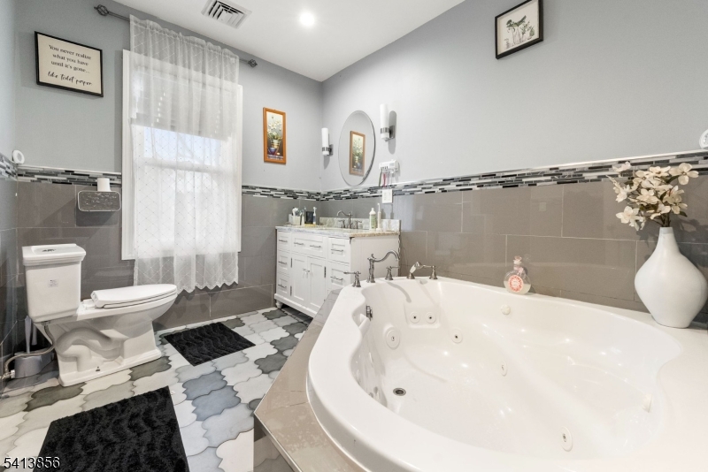 263 Stiles Street Elizabeth, NJ 07208 - Photo 17 of 30 a bathroom with a sink toilet and shower