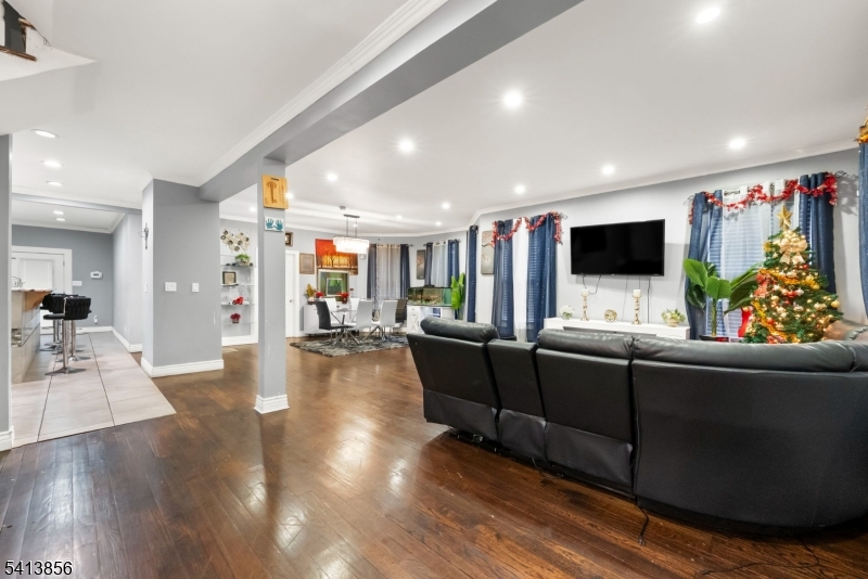263 Stiles Street Elizabeth, NJ 07208 - Photo 10 of 30 a living room with furniture and a flat screen tv