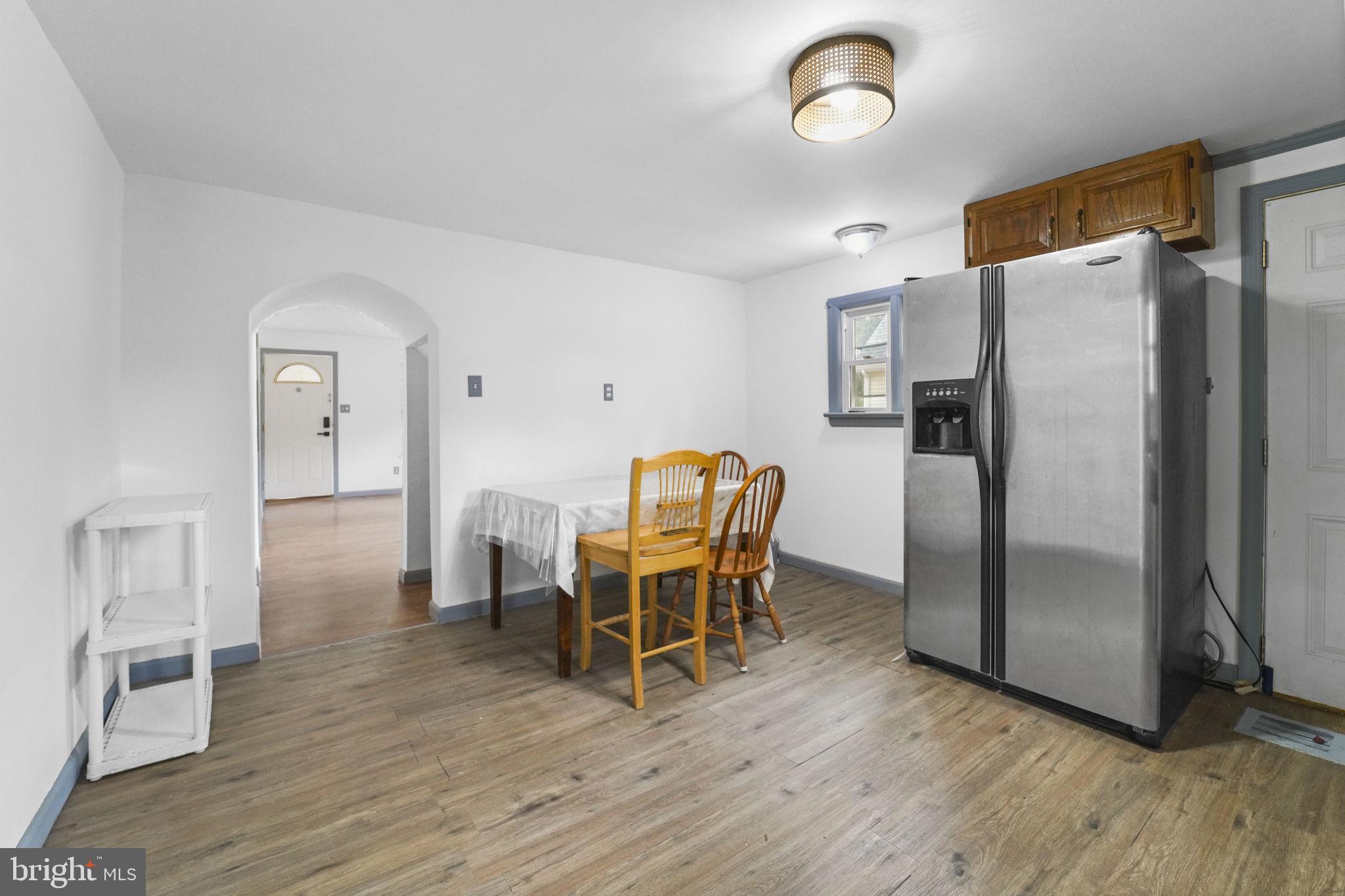 85 East 9th Avenue Pine Hill, NJ 08021 - Photo 12 of 27 a dining room with furniture and a refrigerator
