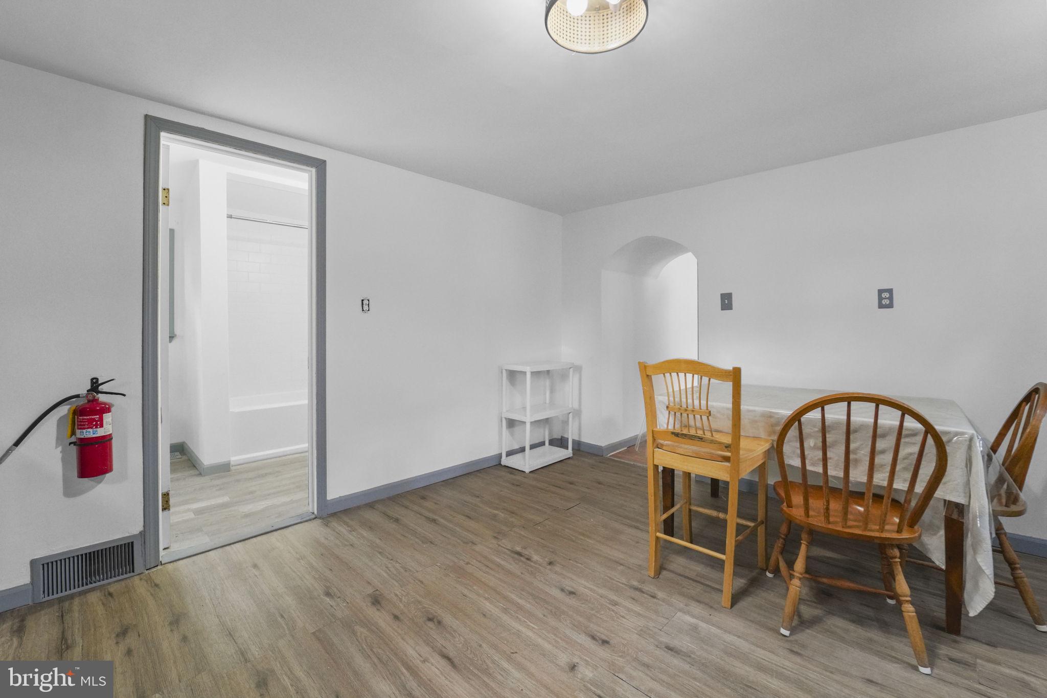 85 East 9th Avenue Pine Hill, NJ 08021 - Photo 13 of 27 a view of a dining room with furniture and wooden floor