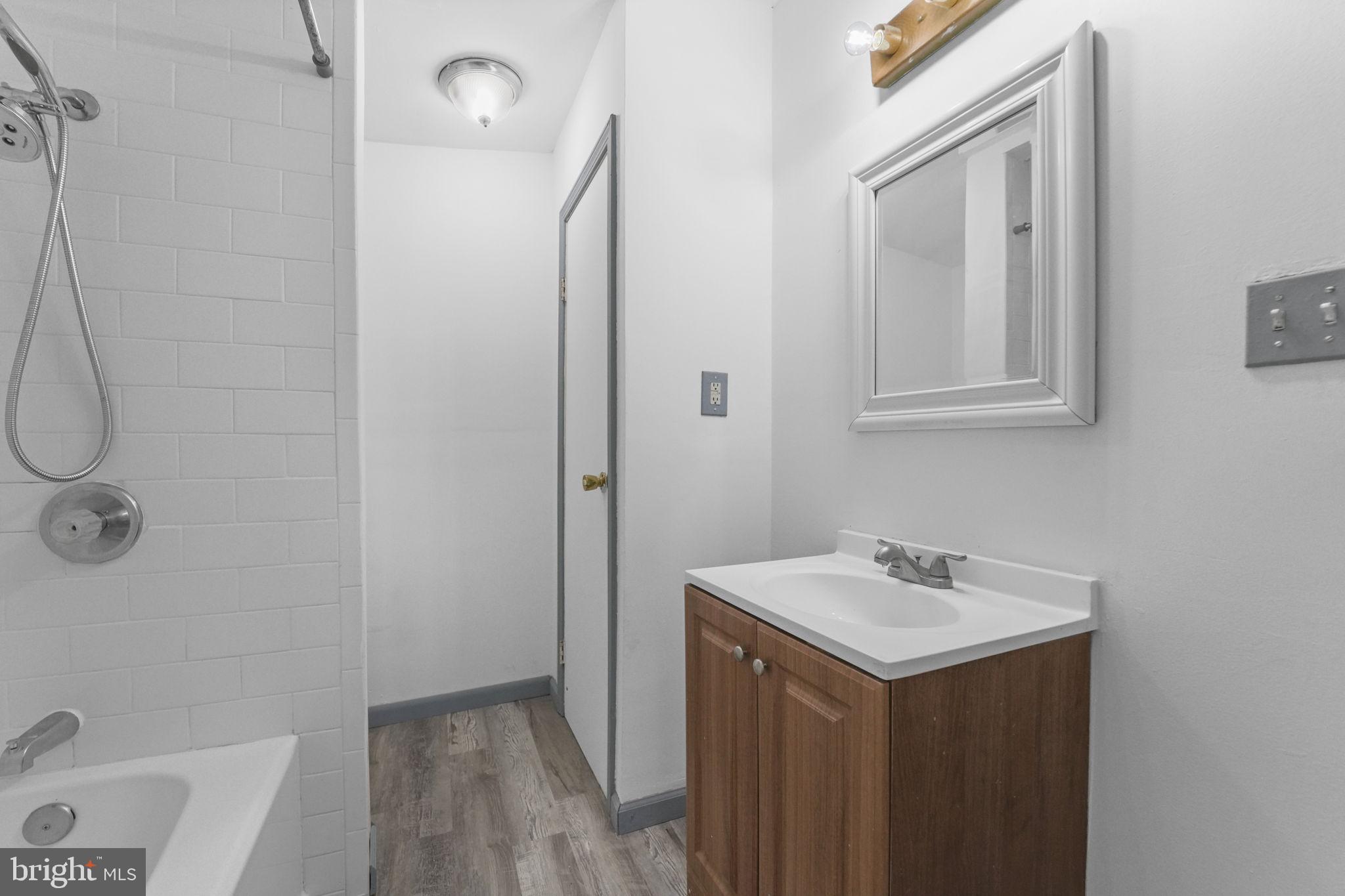 85 East 9th Avenue Pine Hill, NJ 08021 - Photo 14 of 27 a bathroom with a sink a toilet and shower