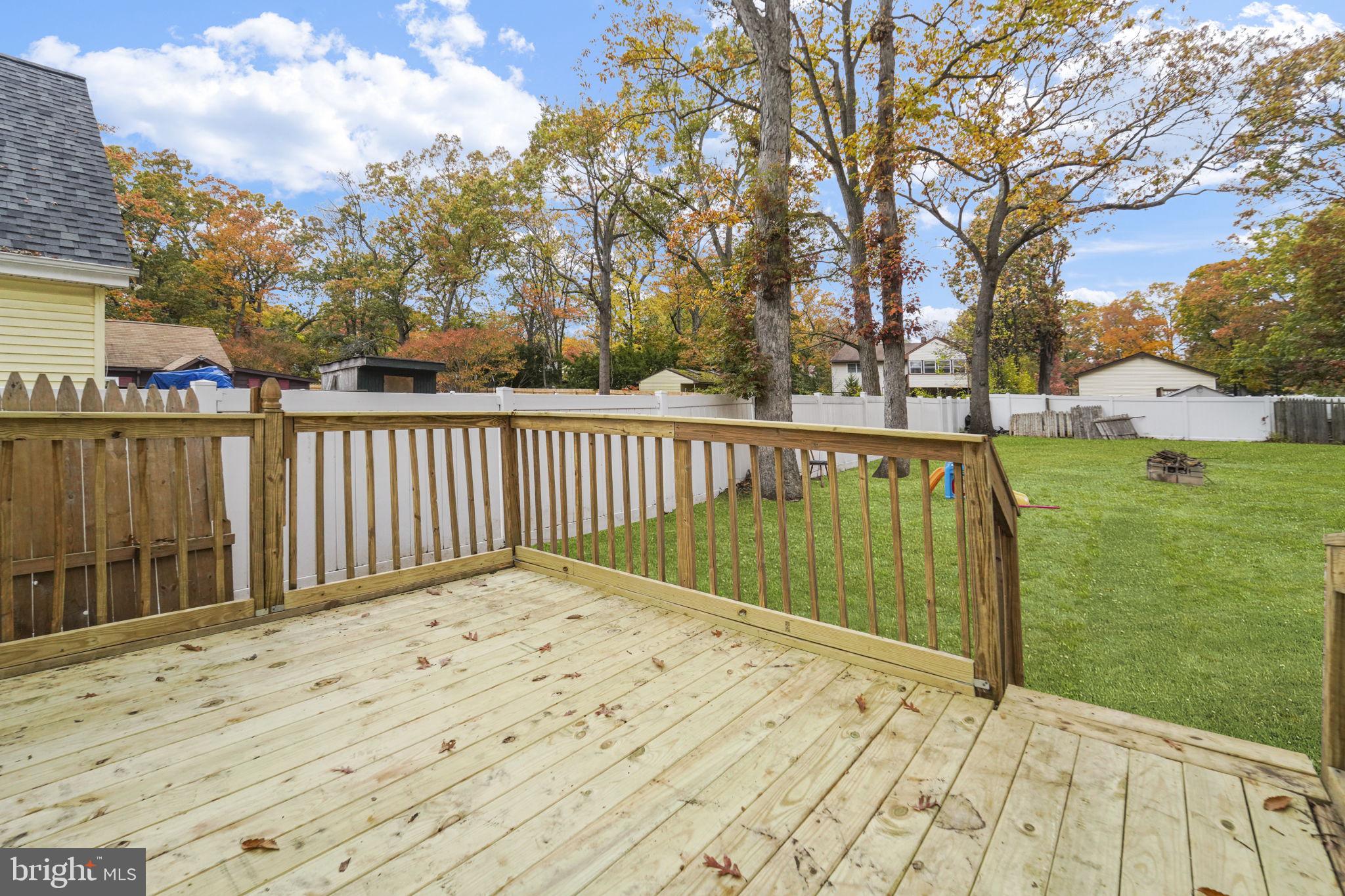 85 East 9th Avenue Pine Hill, NJ 08021 - Photo 20 of 27 a view of balcony with wooden floor and fence
