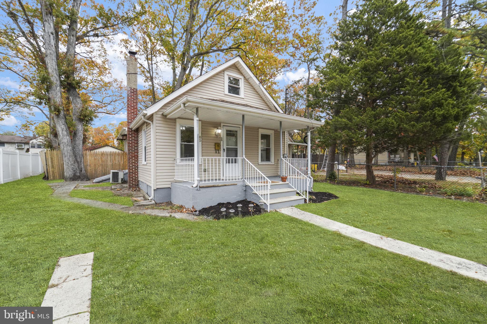 85 East 9th Avenue Pine Hill, NJ 08021 - Photo 2 of 27 a front view of house with yard and green space