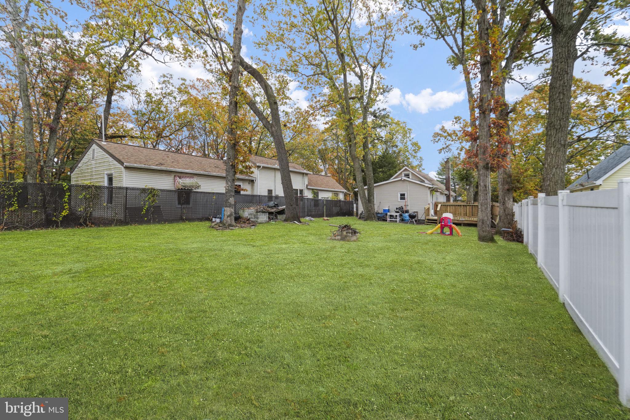 85 East 9th Avenue Pine Hill, NJ 08021 - Photo 23 of 27 a view of a house with backyard and tree