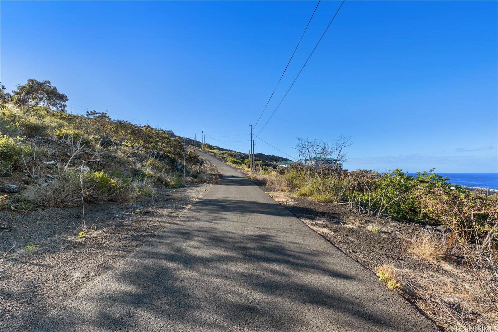 0 Pikake Avenue, Unit LOT 12 Captain Cook, HI 96704 - Photo 12 of 14 a view of a road with a building in the background