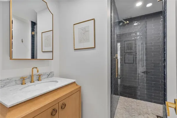 a bathroom with a sink and a mirror
