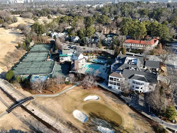 an aerial view of a house with a yard