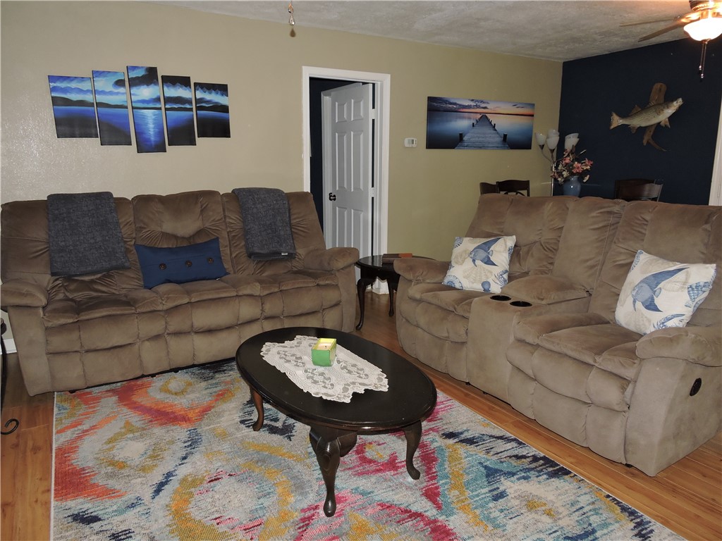 1901 Hattons Ford Road Townville, SC 29689 - Photo 8 of 33 Hardwood floors and warm wall tones create a welcoming and cozy living area.