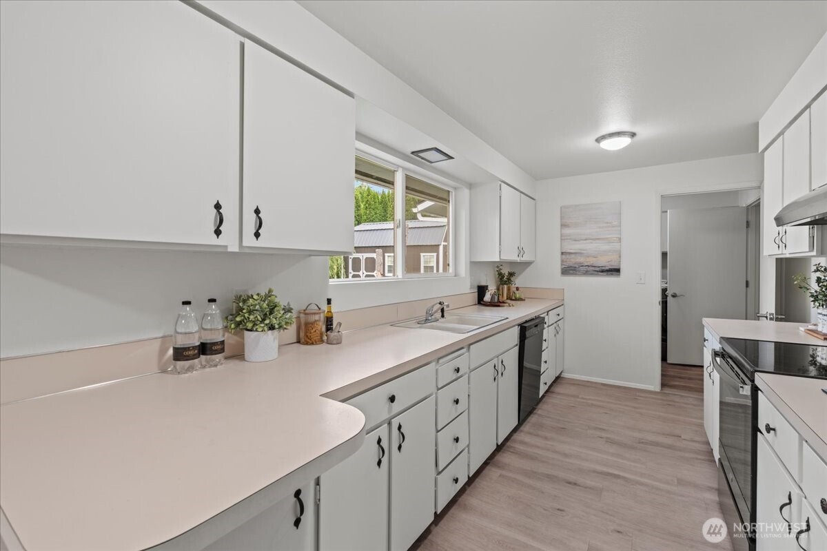 35632 Old Sultan-Startup Road Sultan, WA 98294 - Photo 11 of 40 a kitchen with sink cabinets and window