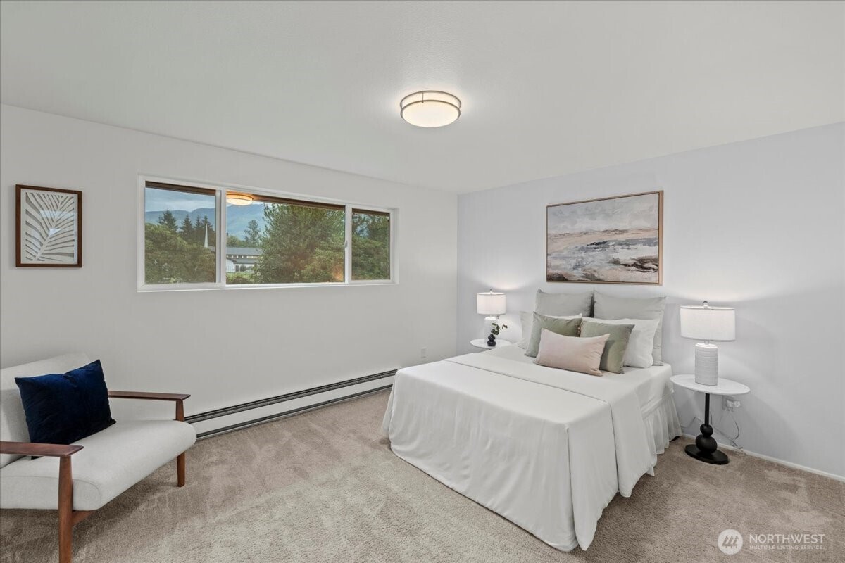 35632 Old Sultan-Startup Road Sultan, WA 98294 - Photo 19 of 40 a bedroom with a bed and a chair