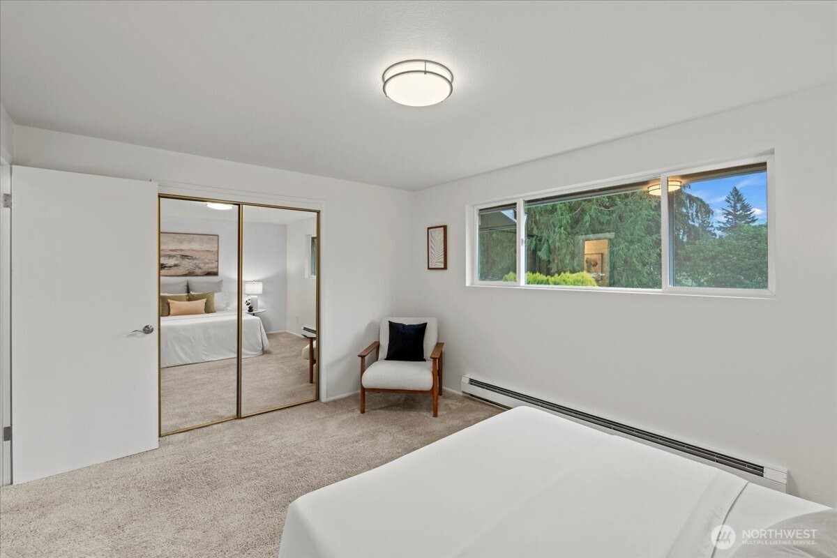 35632 Old Sultan-Startup Road Sultan, WA 98294 - Photo 20 of 40 a bedroom with a bed and a mirror