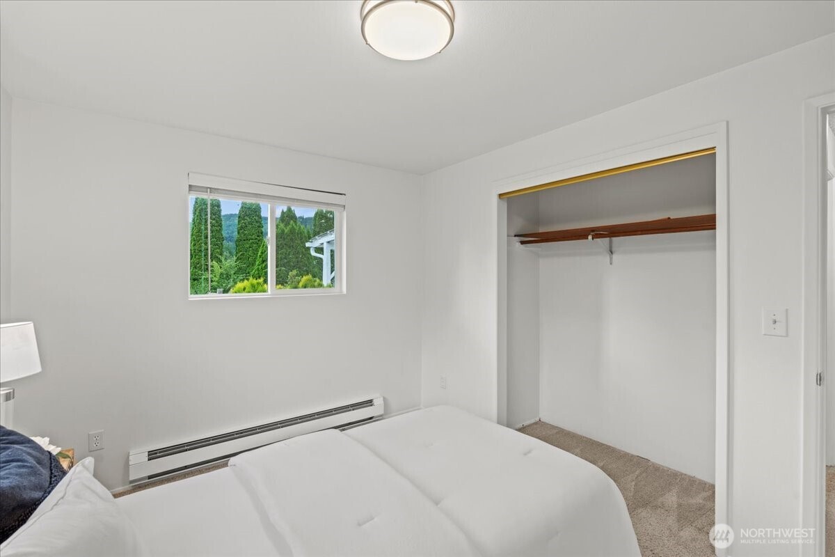 35632 Old Sultan-Startup Road Sultan, WA 98294 - Photo 22 of 40 a bedroom with a bed and a window