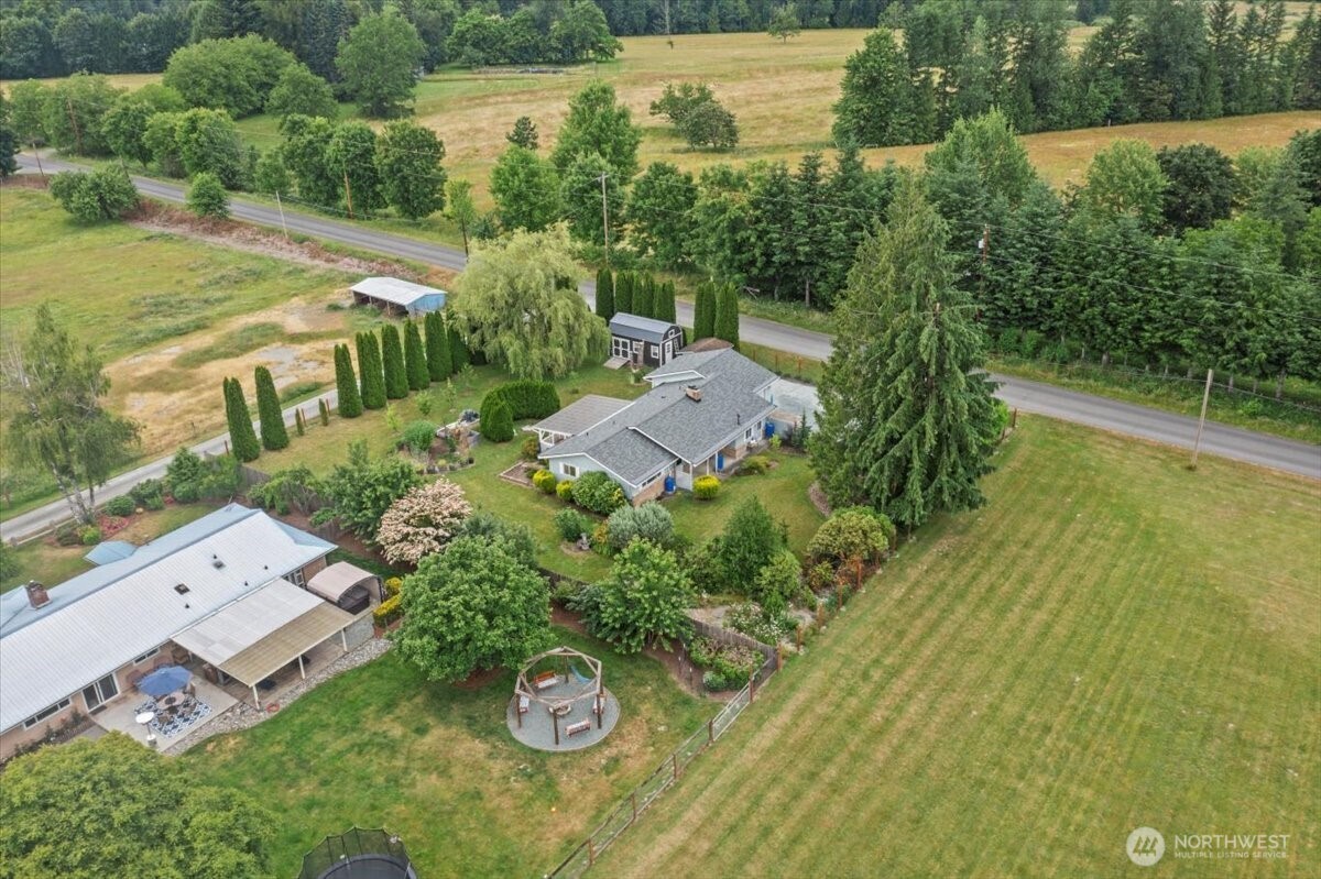 35632 Old Sultan-Startup Road Sultan, WA 98294 - Photo 33 of 40 an aerial view of a house with a garden and lake view