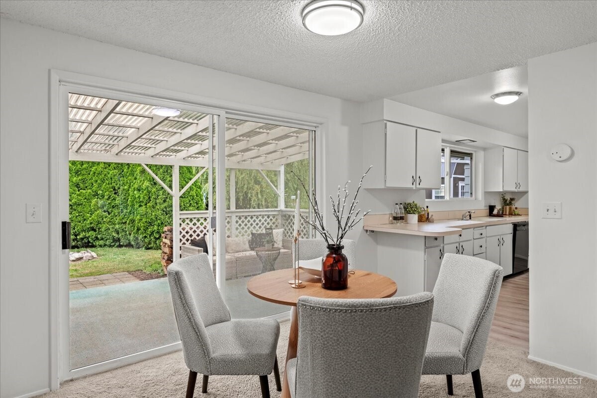 35632 Old Sultan-Startup Road Sultan, WA 98294 - Photo 8 of 40 a kitchen with a table chairs and wooden floor