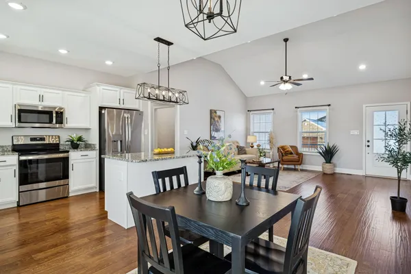 a view of a dining room with furniture window and wooden floor