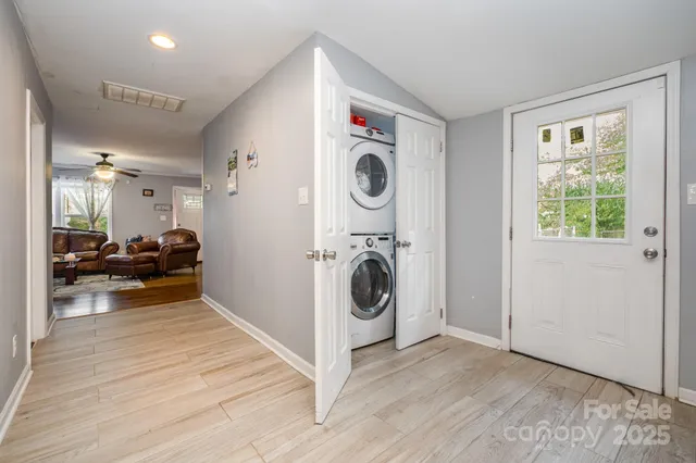 a view of a storage and utility room with washer and dryer