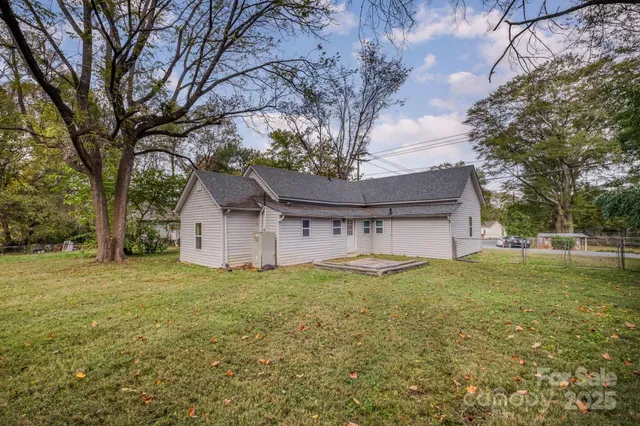 a house that has a tree in front of it