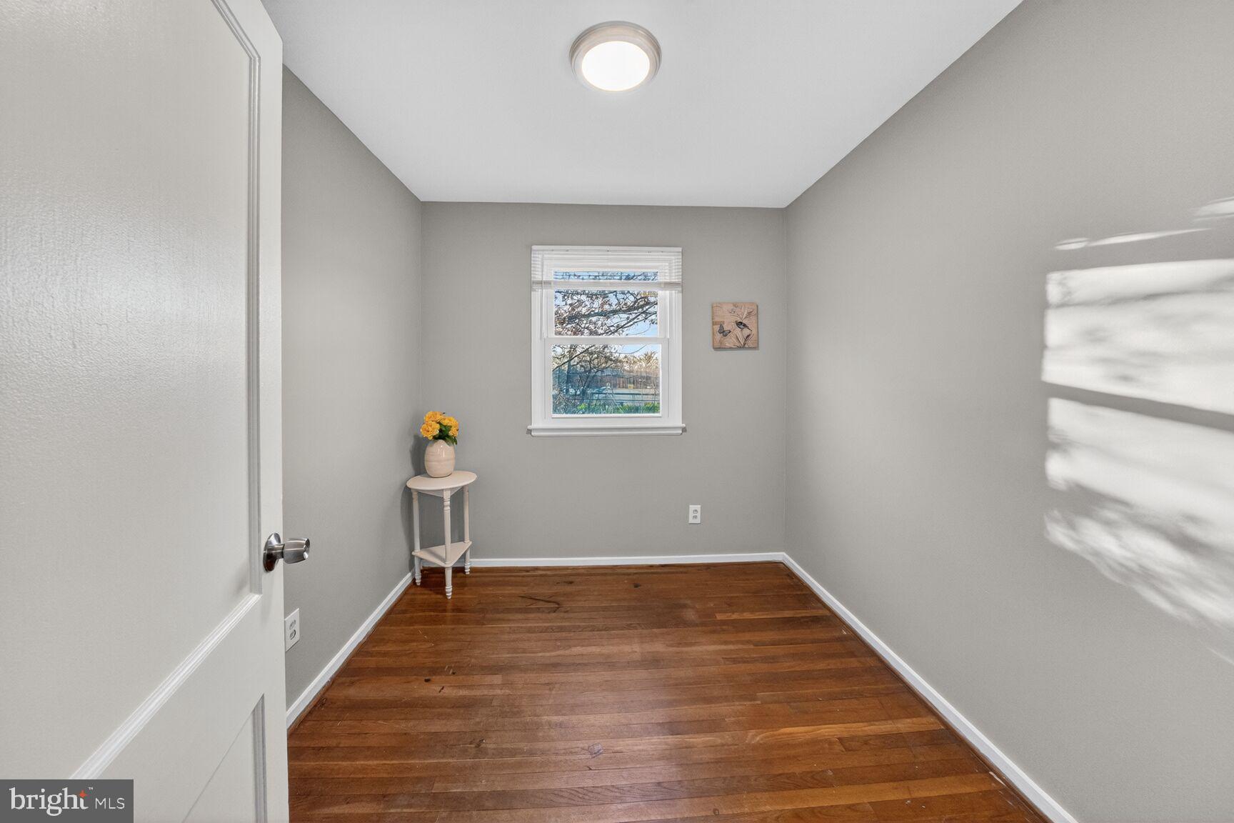 3033 Medway Street Silver Spring, MD 20902 - Photo 23 of 52 a view of a hallway with wooden floor and a window