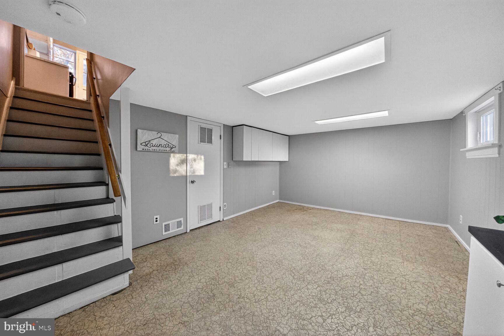 3033 Medway Street Silver Spring, MD 20902 - Photo 31 of 52 a view of an empty room with stairs