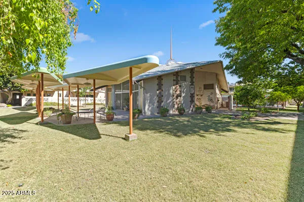 a view of a swimming pool with a patio