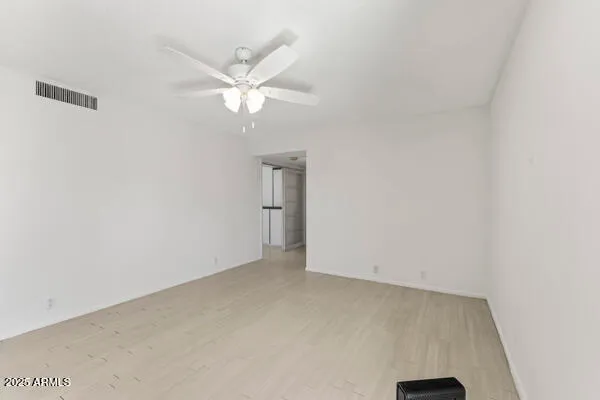 a large white kitchen with a large window