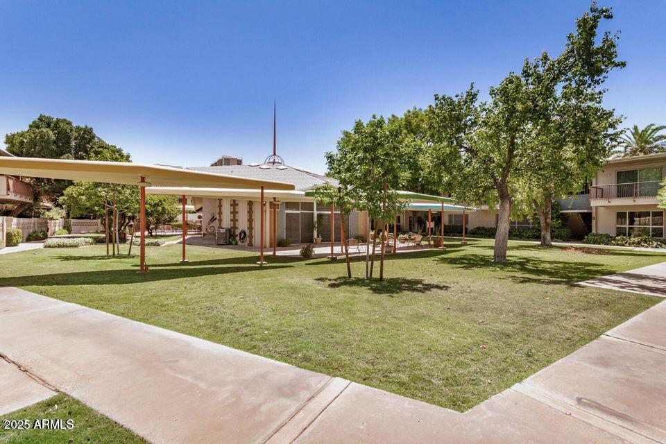 500 West Clarendon Avenue, Unit D6 Phoenix, AZ 85013 - Photo 18 of 23 a view of a house with backyard and sitting area