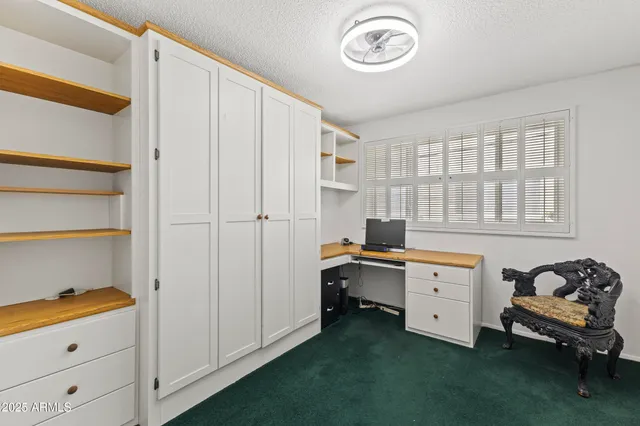 a view of a balcony with chairs